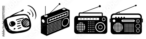 A collection of four different vintage radio receivers with antennas and dials