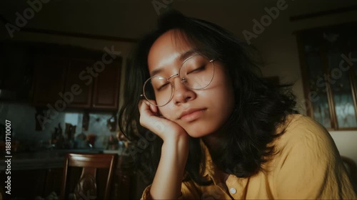 Intimate warm portrait of thoughtful young woman