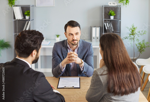 Tablou pe pânză Agent and couple client serious discussion at desk, attentive and sell, buy advi