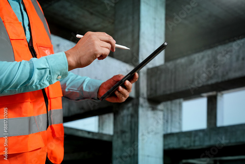 Obraz na płótnie Civil engineers inspect building construction projects, checking the structural integrity and safety measures