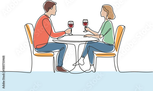 Couple enjoying wine at a table in an outdoor cafe