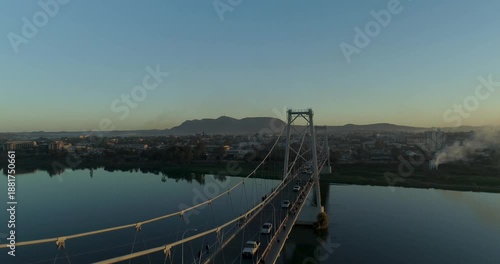 Wallpaper Mural Aerial view of the bridge with cars traversing over the still river contrasting with the urban landscape, Tete, Tete Province, Mozambique. Torontodigital.ca
