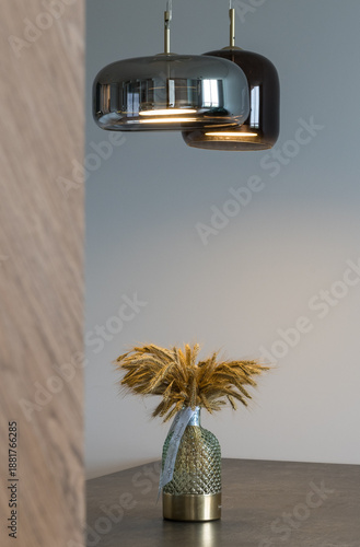 Stylist vignette with pendant lamp and dried arrangement
