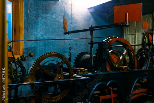 Victorian Age mechanic clock work mechanism metallic cogs indoor plant space view