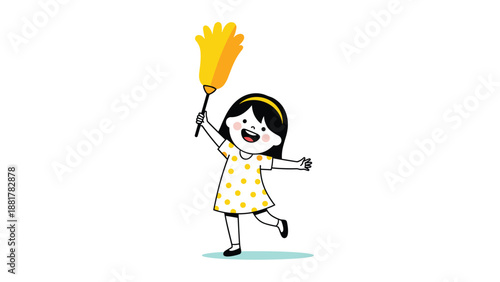 Happy little girl wearing yellow polka dot dress smiles while holding a feather duster, ready for cleaning her home during chore time.