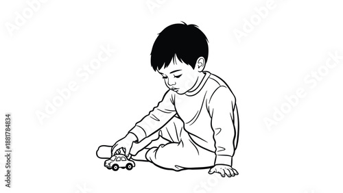 Young child engrossed in playing with a small toy car on a white background isolated
