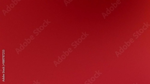 Solid deep red abstract textured background with smooth gradient for design and advertising