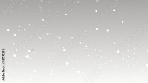A grayscale image depicting a snowy scene with falling snowflakes