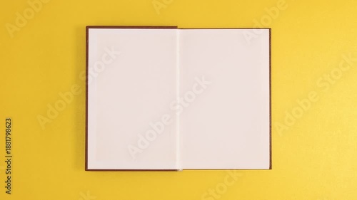 Open Book with Blank White Pages on Yellow Background for Education and Mockup Concept