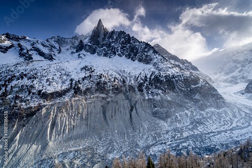 Tablou pe pânză Majestic Alpine peak Aiguille du Petit Dru in winter with beautiful climbing wall and Mer de Glace glacier, Chamonix-Mont-Blanc, France