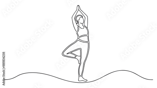 Graceful woman in tree pose, practicing yoga with balanced energy and mindful focus.