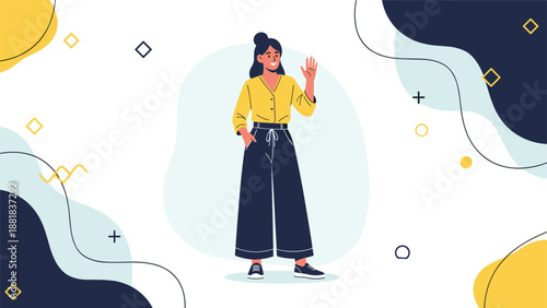 Stylish young woman in yellow shirt and dark pants waves hello against a creative abstract background.