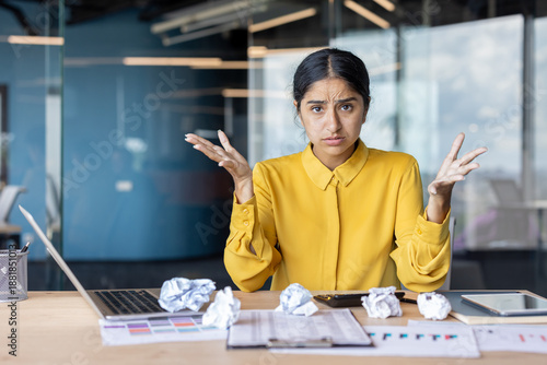 Obraz na plátně Portrait of a disappointed young Indian businesswoman sitting in the office at a