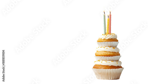 A stack of cupcakes with white frosting and colorful candles on transparent background