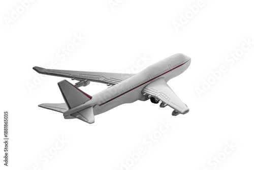 A white toy airplane with red stripes and four engines isolated on a white background.
