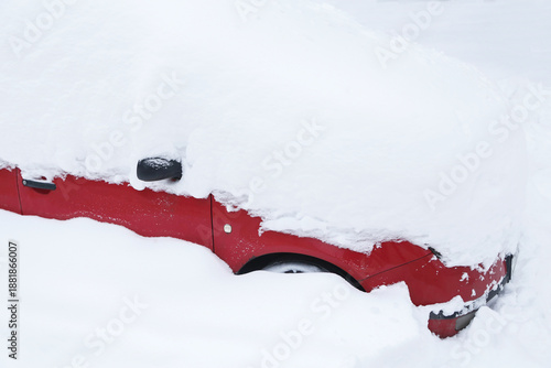 Wallpaper Mural Red car under snow in snowbank close up after heavy snowfall Torontodigital.ca