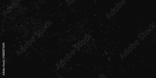 A dark textured background with a scattering of subtle light specks