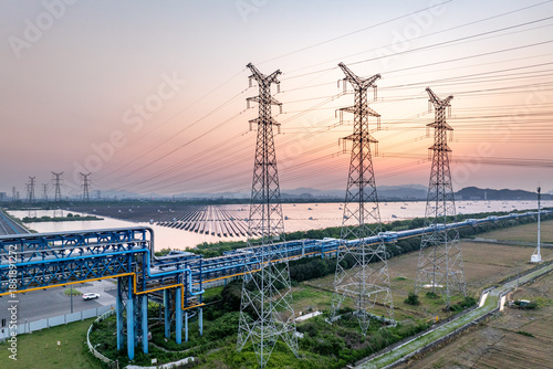 Obraz na plátne Power transmission towers at sunset
