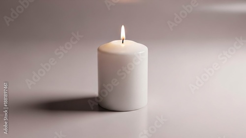 Wallpaper Mural A single white candle with a small flame burns on a plain gray surface casting a soft shadow Torontodigital.ca