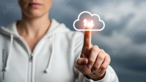 Wallpaper Mural Woman's finger gently touches a bright, glowing cloud icon symbolizing data upload and download services. Torontodigital.ca