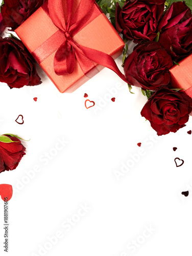 Beautiful and festive background for valentines day or anniversary celebration in pink with pink present and red ribbons roses and copy space 