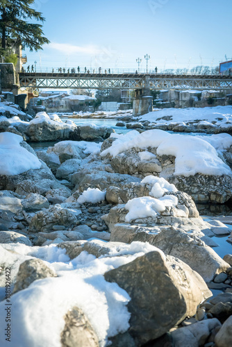 Wallpaper Mural Snowy riverbank and pedestrian bridge in winter Kutaisi, Georgia Torontodigital.ca