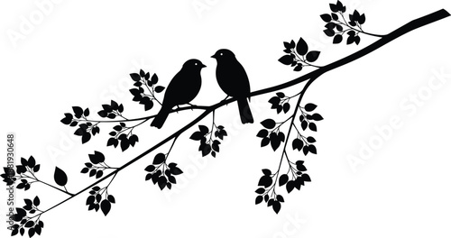 Two black birds sitting on a branch with leaves silhouette