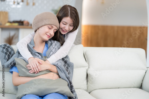 A cancer patient receiving compassionate care and emotional support from a loved one, finding hope and comfort in a moment of embrace during treatment and recovery