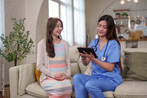 A pregnant woman receiving prenatal care and health consultation from a nurse at home, focusing on pregnancy wellness, maternal support, and healthy motherhood