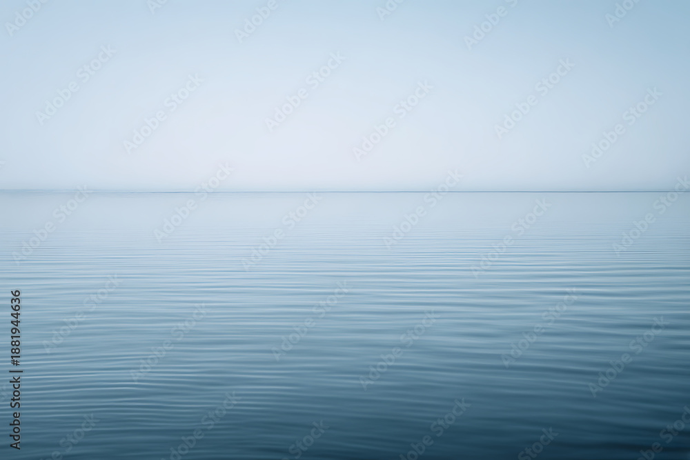 Obraz premium Minimal seascape with calm ocean and soft horizon line. Peaceful natural background for meditation, wellness and conceptual designs.