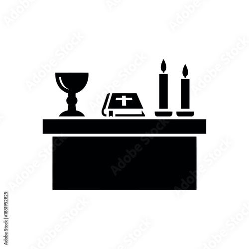 Altar with chalice bible and candles.