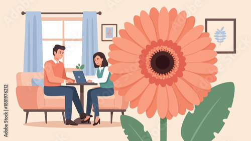 Two people work on laptops in a cozy room with a large orange flower