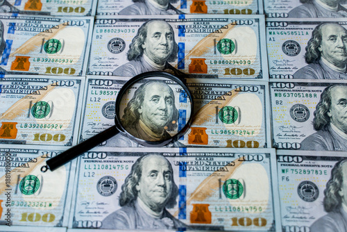 American bills in denominations of 100 US dollars are laid out on the surface and occupy the entire area of ​​the image, the background is made of American dollars, greenbacks of large denominations, 