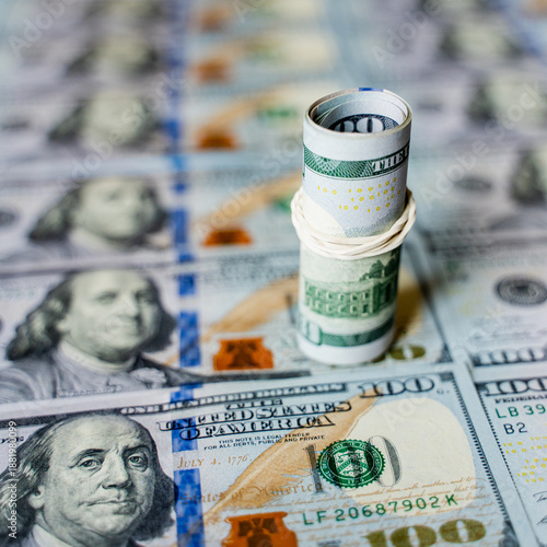 American bills in denominations of 100 US dollars are laid out on the surface and occupy the entire area of ​​the image, the background is made of American dollars, greenbacks of large denominations, 