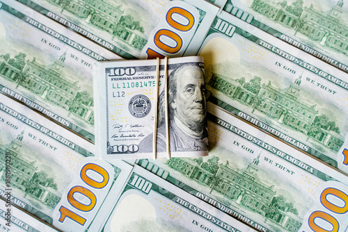 American bills in denominations of 100 US dollars are laid out on the surface and occupy the entire area of ​​the image, the background is made of American dollars, greenbacks of large denominations, 