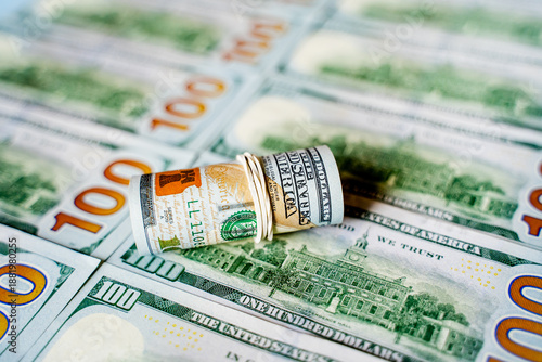 American bills in denominations of 100 US dollars are laid out on the surface and occupy the entire area of ​​the image, the background is made of American dollars, greenbacks of large denominations, 