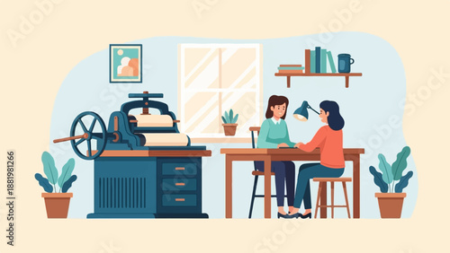 Two women work at a table next to a printing press