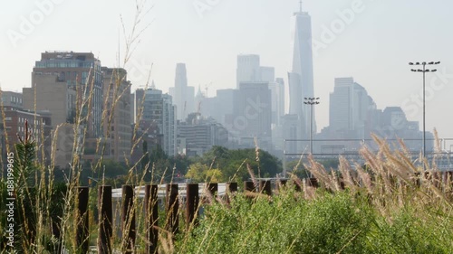 Wallpaper Mural New York City downtown skyline and Little Island pier park in Midtown of Manhattan, United States. Financial district cityscape, world trade center and urban garden oasis on pillars in Chelsea, USA. Torontodigital.ca