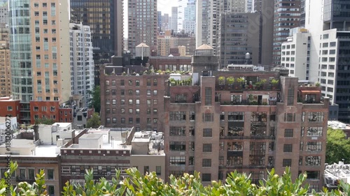 Wallpaper Mural New York City Midtown East urban residential buildings, red brown brick architecture, Manhattan rooftop, United States of America. Water towers on roof. Cityscape with classic water tanks, Turtle Bay. Torontodigital.ca