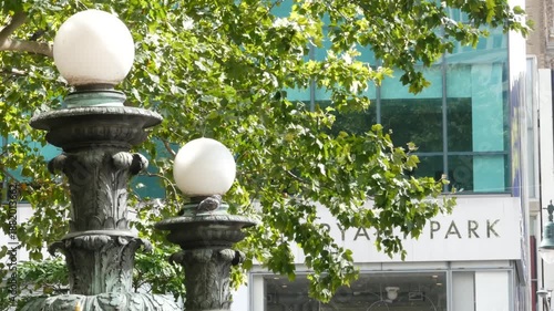 Wallpaper Mural New York City globe lamp in Bryant park near Public Library on 42 street, United States. Summer greenery in famous park of Manhattan Midtown. Green old trees and orb lanterns in NYC, USA. Torontodigital.ca