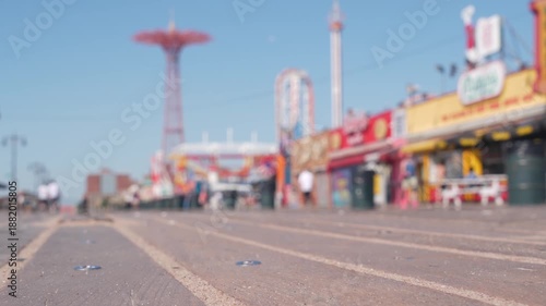 Wallpaper Mural Coney Island beach promenade in Brooklyn, New York, United States. Wooden boardwalk near retro luna park. Amusement park on ocean coast beach. Waterfront summer holiday, people walking on promenade. Torontodigital.ca