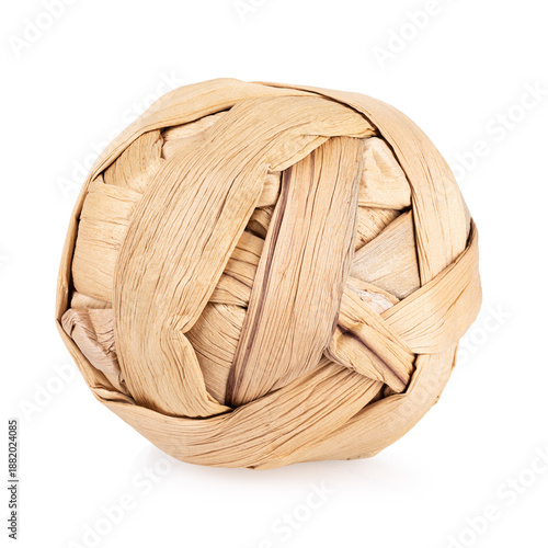 A woven straw ball toy for rodents, rabbits, and hamsters, isolated on a white background