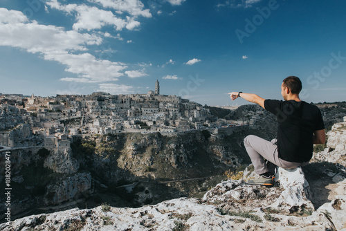 Tourist admiring the beautiful Matera city. 