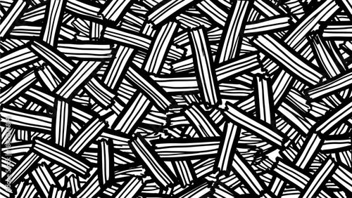 Aerial view of scattered pencil leads on a dark surface in a chaotic pattern