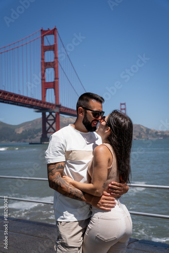 Romantic Couple Embracing by Golden Gate Bridge in San Francisco