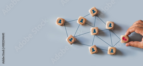 Hands holding wood cube with empathy leadership icon. symbolizing supportive management, trust building, human centered teamwork, workplace connection for corporate use. Empathy in leadership concept