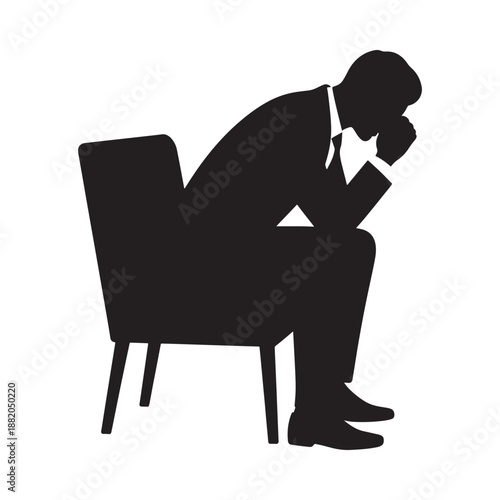 a man seated in a chair head in hand depicted as a striking silhouette