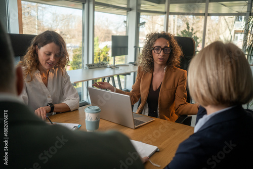 Businesswoman disappointed with team performance during stressful office meeting