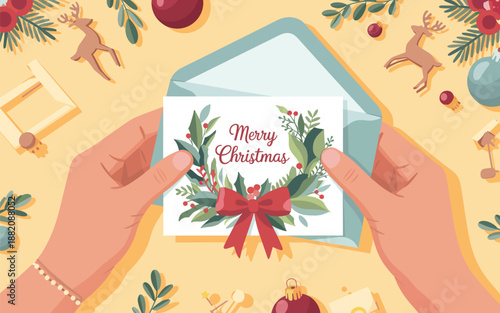 Hands holding a Christmas card with a festive wreath and red ribbon against a vibrant holiday background