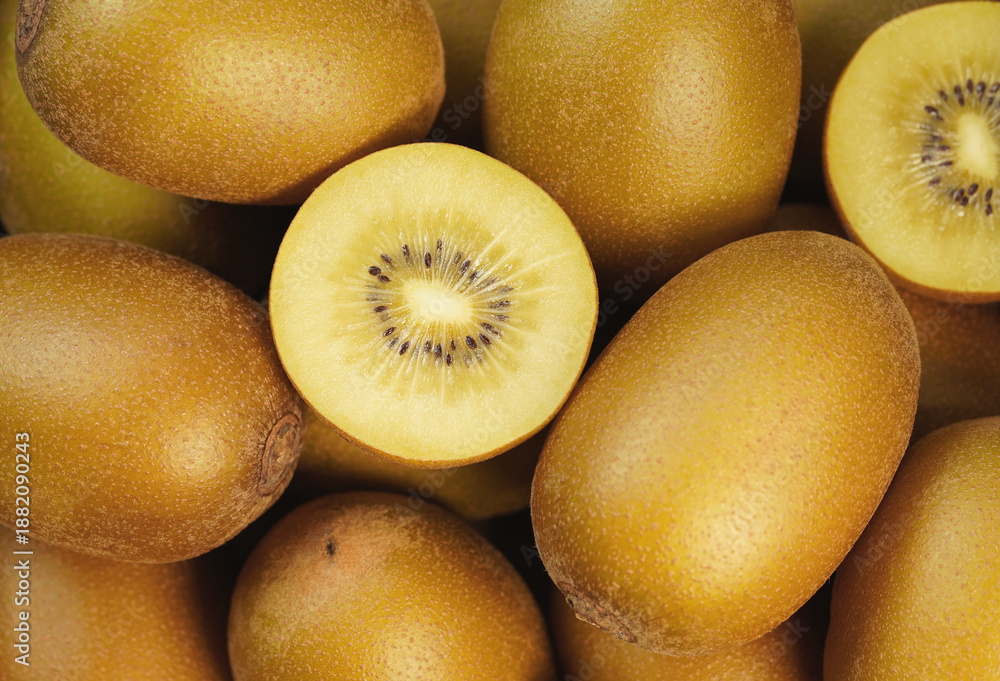 Fototapeta premium Kiwifruit Background Sliced Fresh And Juicy Yellow Kiwi Gold